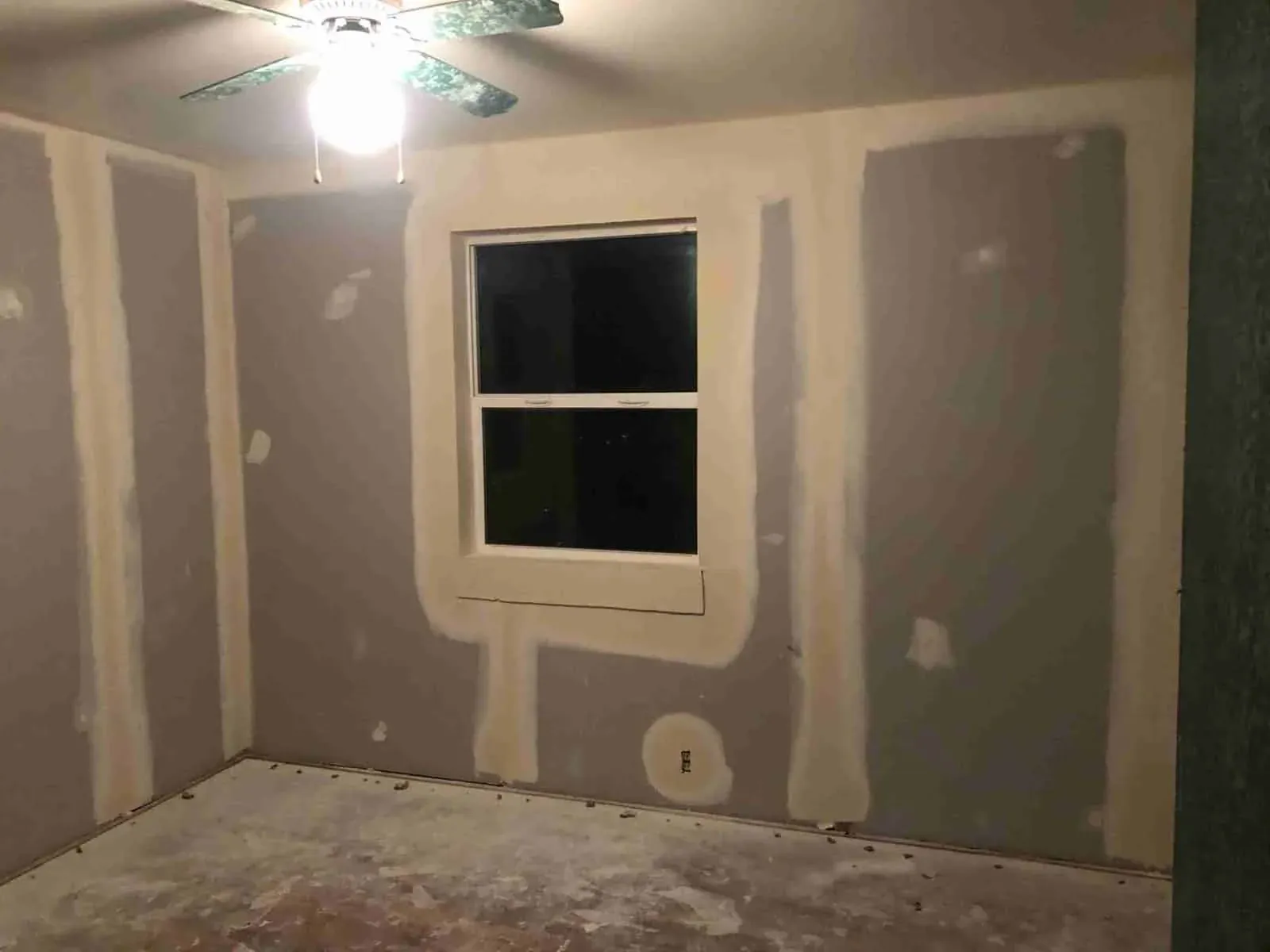 Room with drywall joints coated during the finishing process